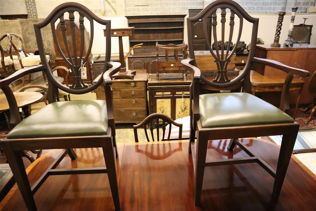 A Georgian style satinwood-banded mahogany D-end dining table with additional leaf, 195cm extended and a set of eight Hepplewhite style